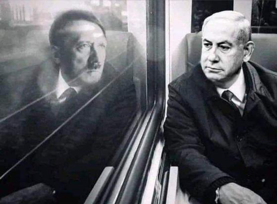 Reflection of Netanyahu in a train carriage window. The reflection is Hitler. Both are guilty of mass murder.