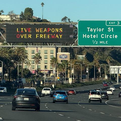 A warning over a highway near Interstate 5 alerted drivers about the military using live weapons on Saturday.