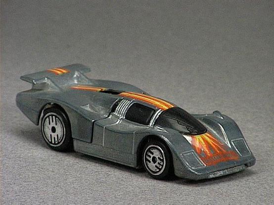 Released in 1984, Unpainted Sol-Aire CX4 of 1984 Hot Wheels with Ultra Hot wheels. Notes: Concept car with a rear wing and an opening rear hood. Tampo: Yellow, red and orange stripe with 'Ultra Hots' in front. Packaging: 1984 Blister. Metal Body, Metal Base. Made in Malaysia. Scarcity: 4/10