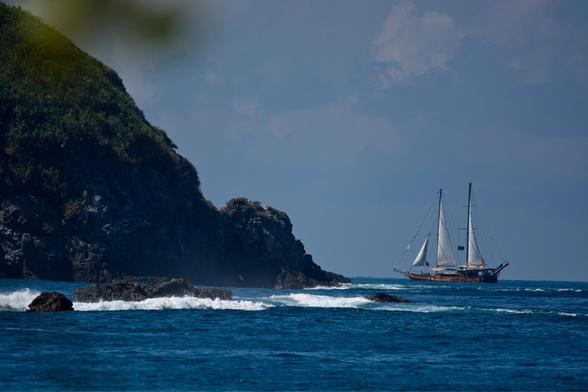 Big ship between rocks