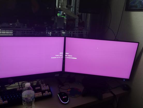 Kernel Panic please reboot your computer centered across the two monitors - kind of Pink/Purple screen of death