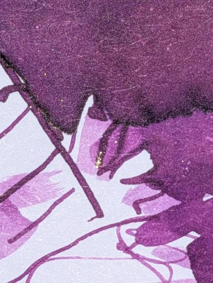 A closeup of where the sandworm is erupting from the sand, catching a little chameleonic shine amongst the purple.