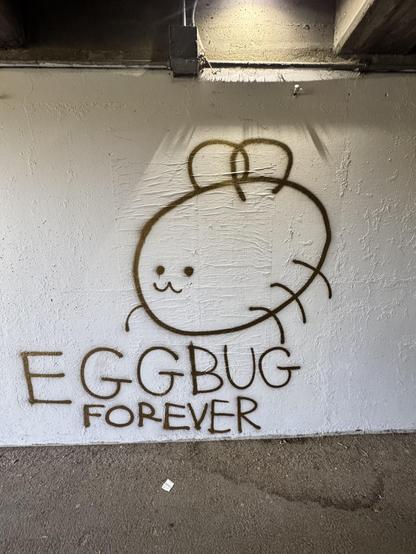 Large spray paint line drawing of eggbug (mascot of the defunct website cohost) and the text "eggbug forever"