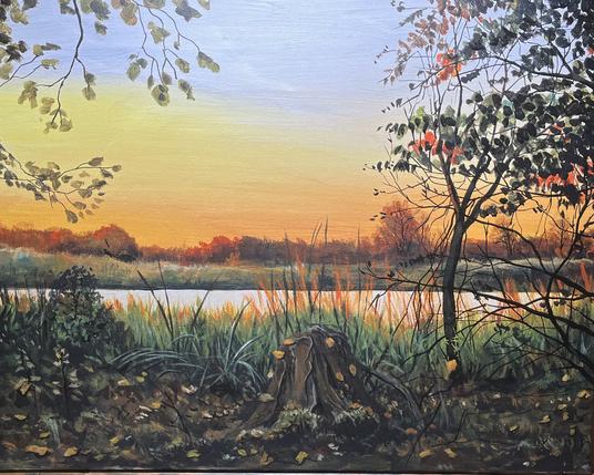 Landscape painting of a calm river at sunset, with warm orange and yellow skies reflecting on the water. Dark foliage and a tree stump frame the foreground, while autumn trees glow softly in the fading light.