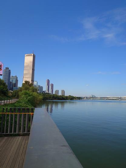 The view on the Han River from Yeouido. skyscrapers on the left. sunny weather.
