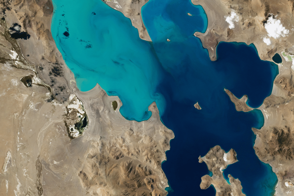 This astronaut photo shows Ngangla Ringco, a high-altitude saline lake on the Tibetan Plateau.