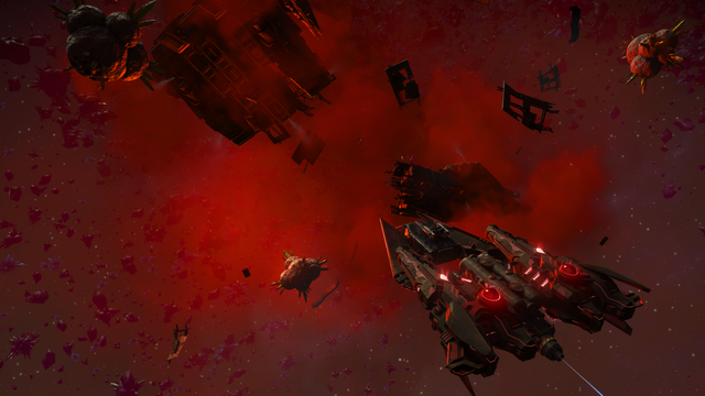 A screenshot of No Man's Sky, showing a Corvette approaching the wreckage of a ship in space. Credit: Hello Games.