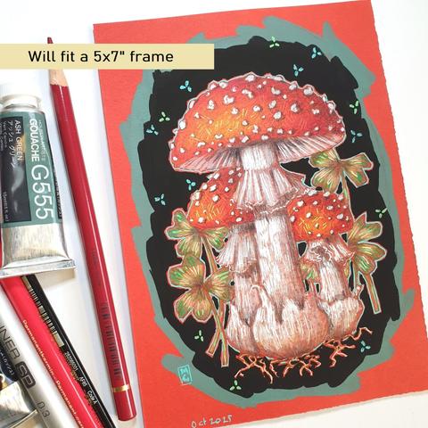 A small fly agaric mushroom illustration on red paper. The drawing depicts these iconic red mushrooms with clover on a black background with a green border.
Famous, enchanting and highly toxic. Fly agaric is the home of fairies and magical creatures and a lover of birch woodland.
An original art work, please note that the frame is not included.
Colour pencil and mixed media on acid free toned artist paper
5 by 7 inches (12.7 by 17.8 cm).