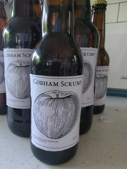 Home made labels on glass bottles of cider