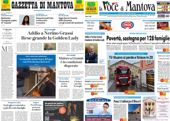 Due prime pagine di giornali affiancate su uno schermo nero. A sinistra c’è la “Gazzetta di Mantova”, a destra “la Voce di Mantova”. Entrambe presentano notizie locali in evidenza, titoli grandi e fotografie. Sulla Gazzetta di Mantova il titolo principale è “Addio a Nerino Grassi. Rese grande la Golden Lady”, con una foto e altri articoli minori. La Voce di Mantova mette invece come notizia centrale “Povertà, sostegno per 128 famiglie” con una foto di un camion rosso in strada e altri articoli più piccoli. Gli impaginati sono ricchi di testo e immagini, con alcune piccole pubblicità colorate in alto e in basso.