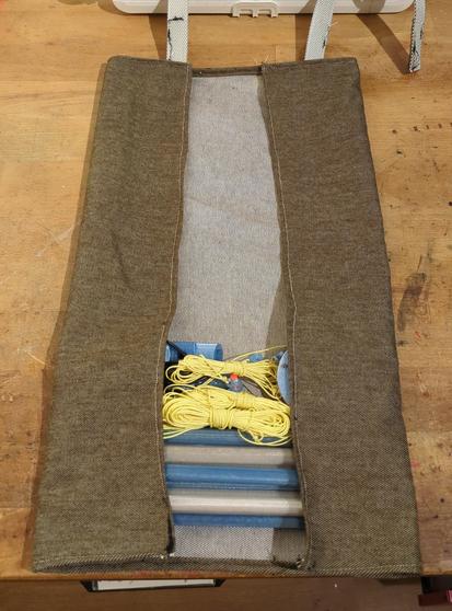 Same fabric folded over the rods.