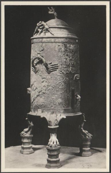 Monochrome real photographic postcard showing a view of the circular cooker decorated with figurines from Pompeii at the Museo Nazionale in Napoli, Italy.

Published by Fratelli Alinari, Firenze, I.D.E.A., No 11269, c.1950.

Postally unused.

Very good condition, with very slight corner bumps.