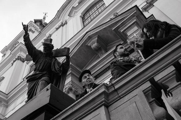 Visitors to the Church of the Holy Cross in Warsaw are overlooked by a statue of Christ carrying the cross.