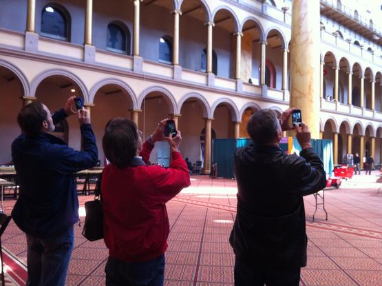 Everyone else in my party at this precise moment.

A photo from the rear of 3 people holding their phones up to take a picture of the interior of the building.
