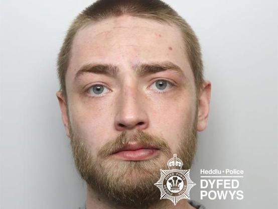 Mugshot of Jack Griffiths, 23, from Ammanford, who was sentenced at Swansea Crown Court for controlling behaviour and assaults in Tenby and London. Credit: Dyfed Powys Police.