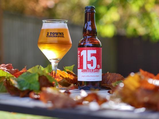 🍂 Celebrating 15 Years with 2 Towns 🍾
Snapped this pic a few days ago during a quick break from raking leaves — and wow, this 15th Anniversary release from @2townsciderhouse was the perfect reward! 🌟

Fast forward to today: it’s raining, the rake’s retired for now, and we’re definitely not complaining. ☔️🍎 Just kicking back and cracking open another bottle of this fun, celebratory cider instead.

Cheers to 15 years of great cider and cozy fall moments! 🥂🍁

And how does it taste? Well ...
2 Towns 15th Anniversary: Out of the bottle, poured at angle to avoid any leftover yeast from clouding up the cider, 15th Anniversary temporarily creates a hefty amount of shaving-cream white head, resting on a clear pool of gold, almost blushed gold. Receding, after our vigorous swirl, there remains a wreath of lacing inside the glass. 
Swirling and sniffing, we recover notes of slight oxidation, bubblegum, and pale straw. 
Sipping, those same notes are there along with pear, some spice, and cit