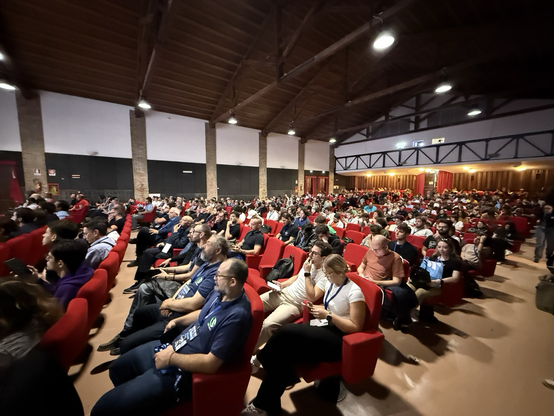 A cinema room full of people attending the talk