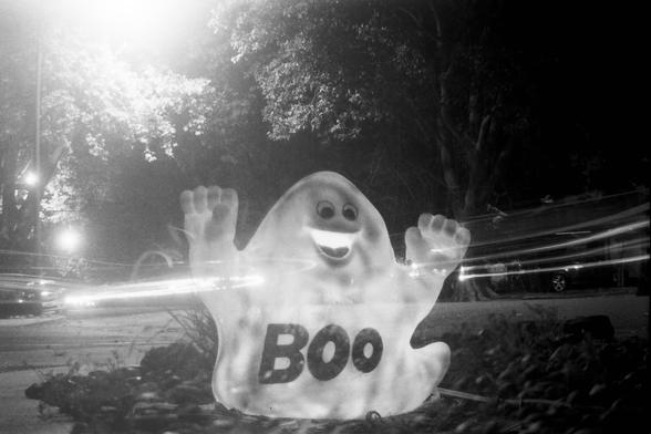 silly ghost imposed over a dark intersection