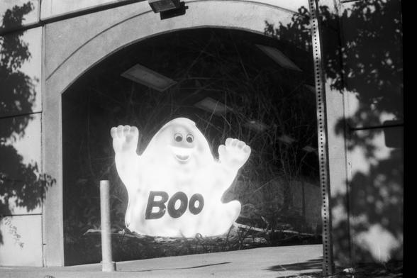 silly ghost imposed over a dark tunnel