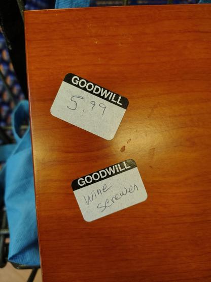 A wood box labeled "Wine Screwer."