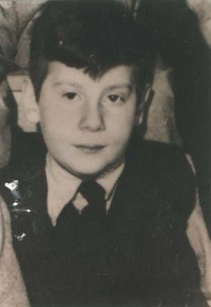 A photo of a young boy in a sweater and a tie. Dutch Jewish boy, Leo Stein.