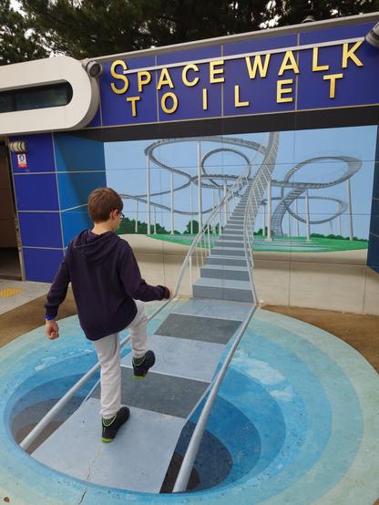 Illusion made with my son climbing the drawing of the Space Walk stairs in front of the toilet