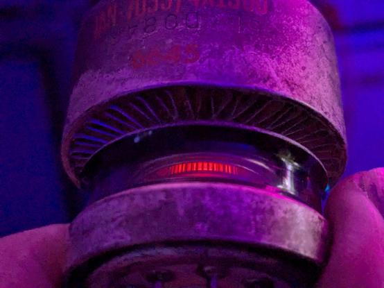 a 4x150d tube with the filament glowing, visible through the glass body