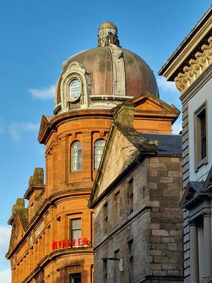 The rooftops of three neighbouring Victorian buildings in Virginia Street in central Glasgow.