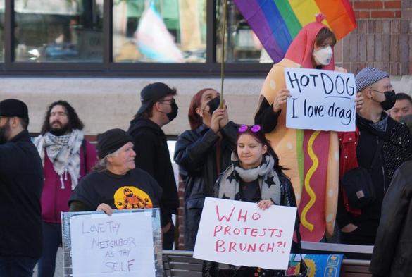 Counter protesters included a woman dressed as a hot dog with a sign reading: Hot Dog, I love drag