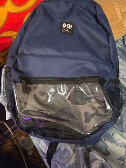 A blue GO!SAC backpack with a display pocket sewed on. It is crooked.