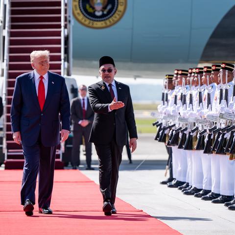 Prime Minister Anwar Ibrahim of Malaysia welcoming President Trump to Kuala Lumpur, the capital, on Sunday.