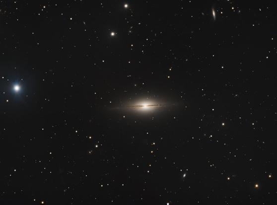 a distant galaxy that is facing sideways from a viewer