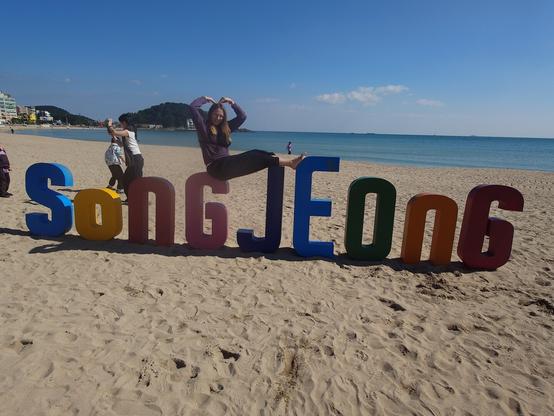 Me posing on the Sengjeong characters on the beach