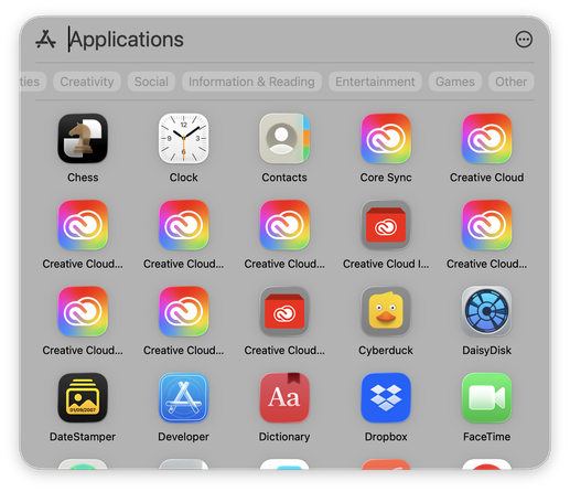 Screenshot of Apps in macOS Tahoe with 9 of them titled Creative Cloudโฆ plus Core Sync