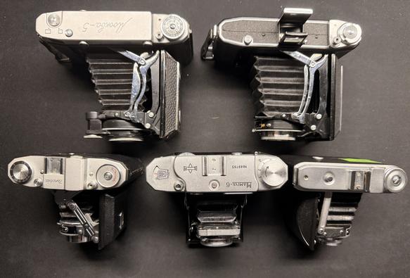 5 folding cameras from above, extended
