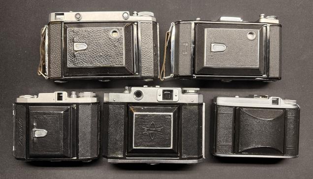 5 folding cameras from the front, closed up