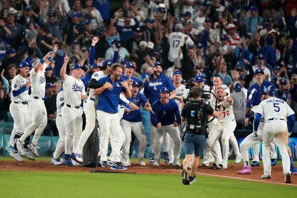 The Dodgers celebrate after Freddie Freeman's walk-off home run decided Game 3 of the World Series.