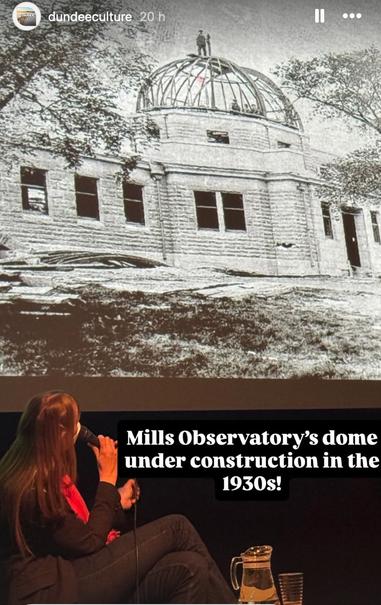 A picture of the Mills observatory under construction.  A man is standing precariously on top of the half-finished dome.  Catherine is looking up at it holding a microphone.

From Insta@DundeeCulture
