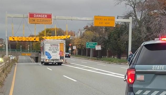 U-Haul driver backs right up into one of the CARS ONLY signs that should have made him pause but didn't