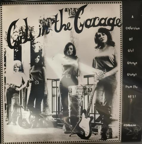 LP cover for Girls In The Garage a Various Artists compilation. Black and white cover showing a 60s band stood up next to their musical instruments.
