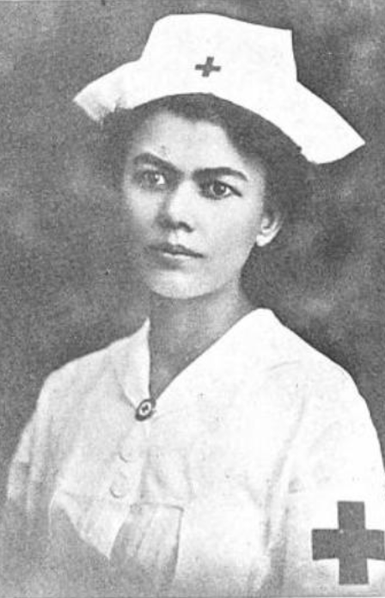 Ursula Tibbels Auer, from a 1927 publication; a woman with olive skin and dark hair and eyes, wearing a nurse's uniform