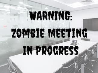 Black and white photo of a table with creepy font text with "Warning: Zombie meeting in progress"
