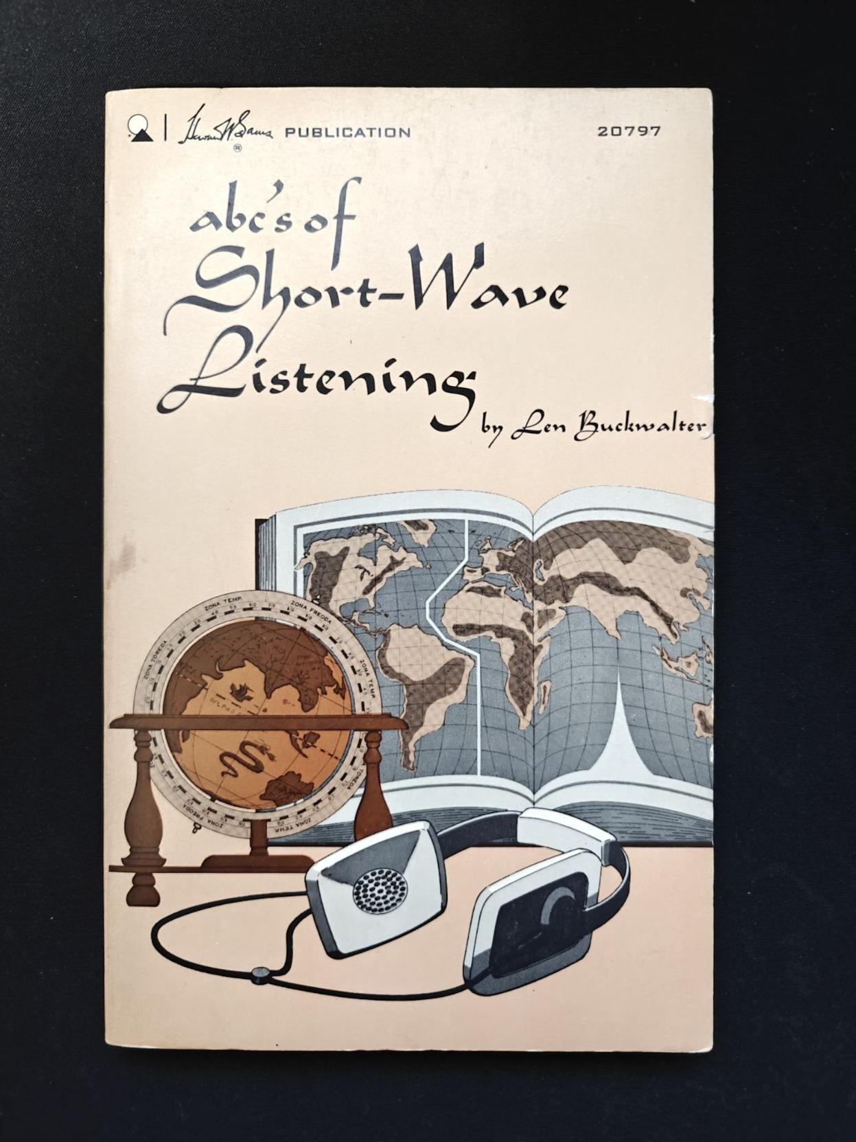 Front cover of the book "ABC's of Short-Wave Listening" by Len Buckwalter  from 1970. It shows a drawing of a globe, an atlas, and headphones.