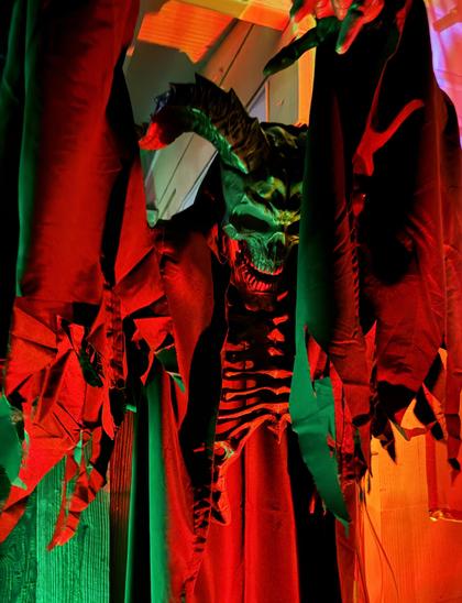 A hanging red and green demon