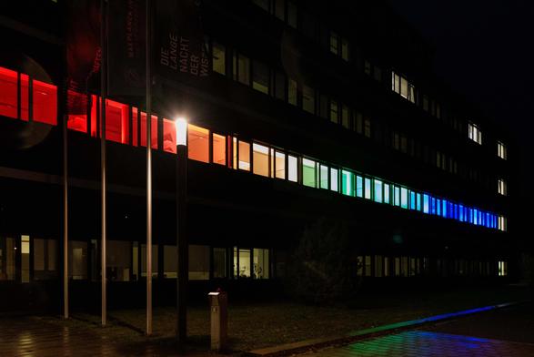 MPL building illuminated in rainbow colors for the Long Night of Sciences.