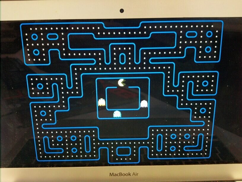 a procedurally generated Pac-Man maze from xscreensaver's Pac-Man module. There is a small circular loop in the center around the ghost house in which Pac-Man and the ghosts are trapped, with no path out to the larger maze where all the dots are.