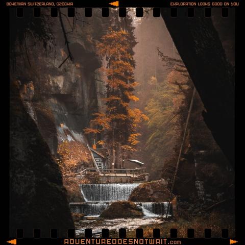 Autumn foliage frames a serene waterfall in Bohemian Switzerland, Czechia, a testament to the exploration-ready style of our eco-friendly apparel