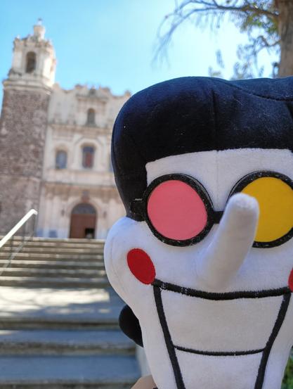 In front of an old stone temple of the franciscal order