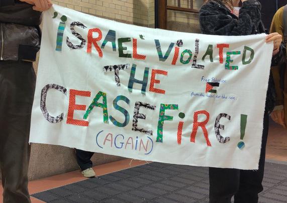 Protest Banner: 
Israel violated the ceasefire