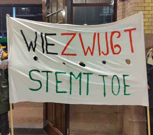 Protest Banner: silence means complicity